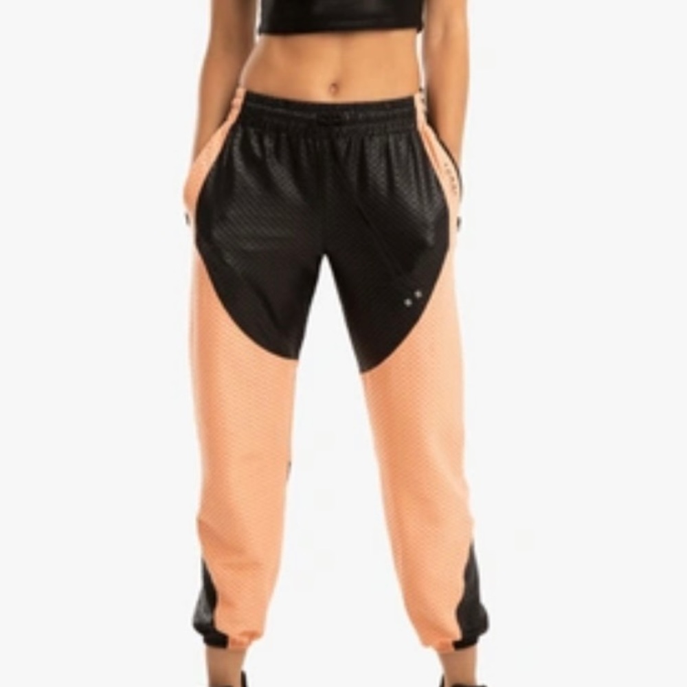 KORAL LUXE NETZ SWEATPANTS - BLACK/POMPANO ORANGE Your studio-to-street staple: